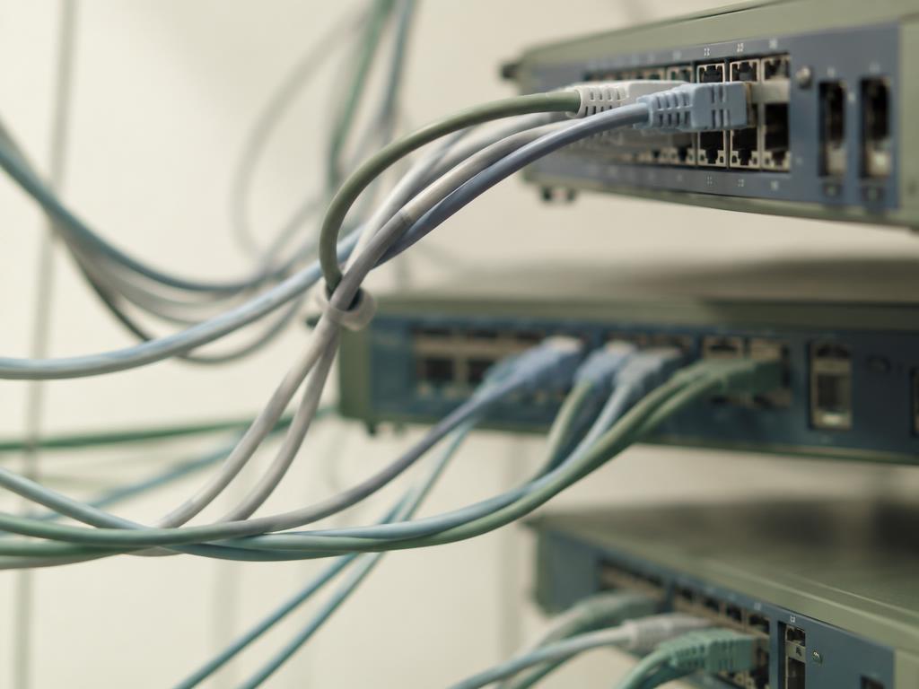 Network switches and cables forming a web of dependencies